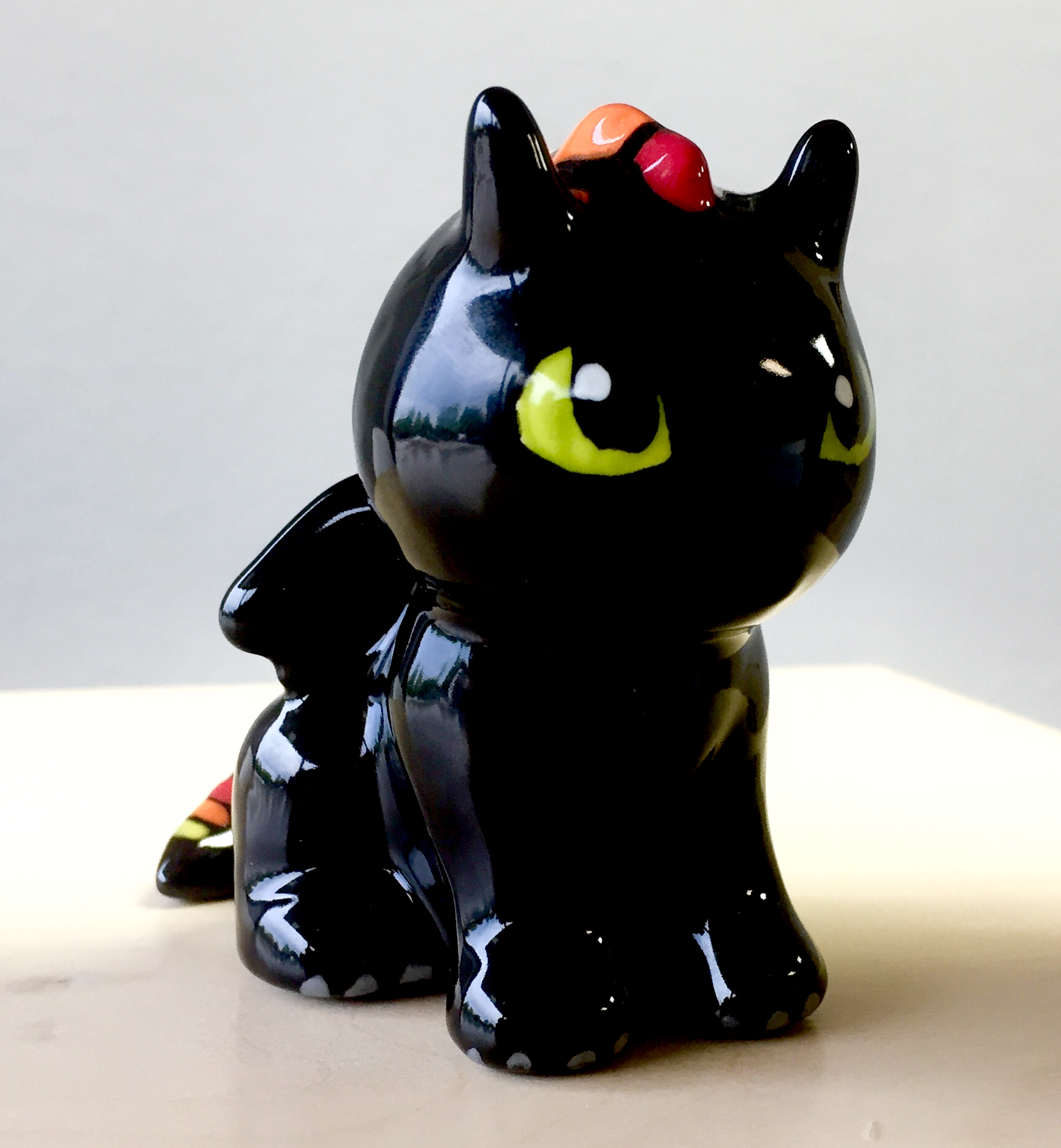 Painted black ceramic dragon
